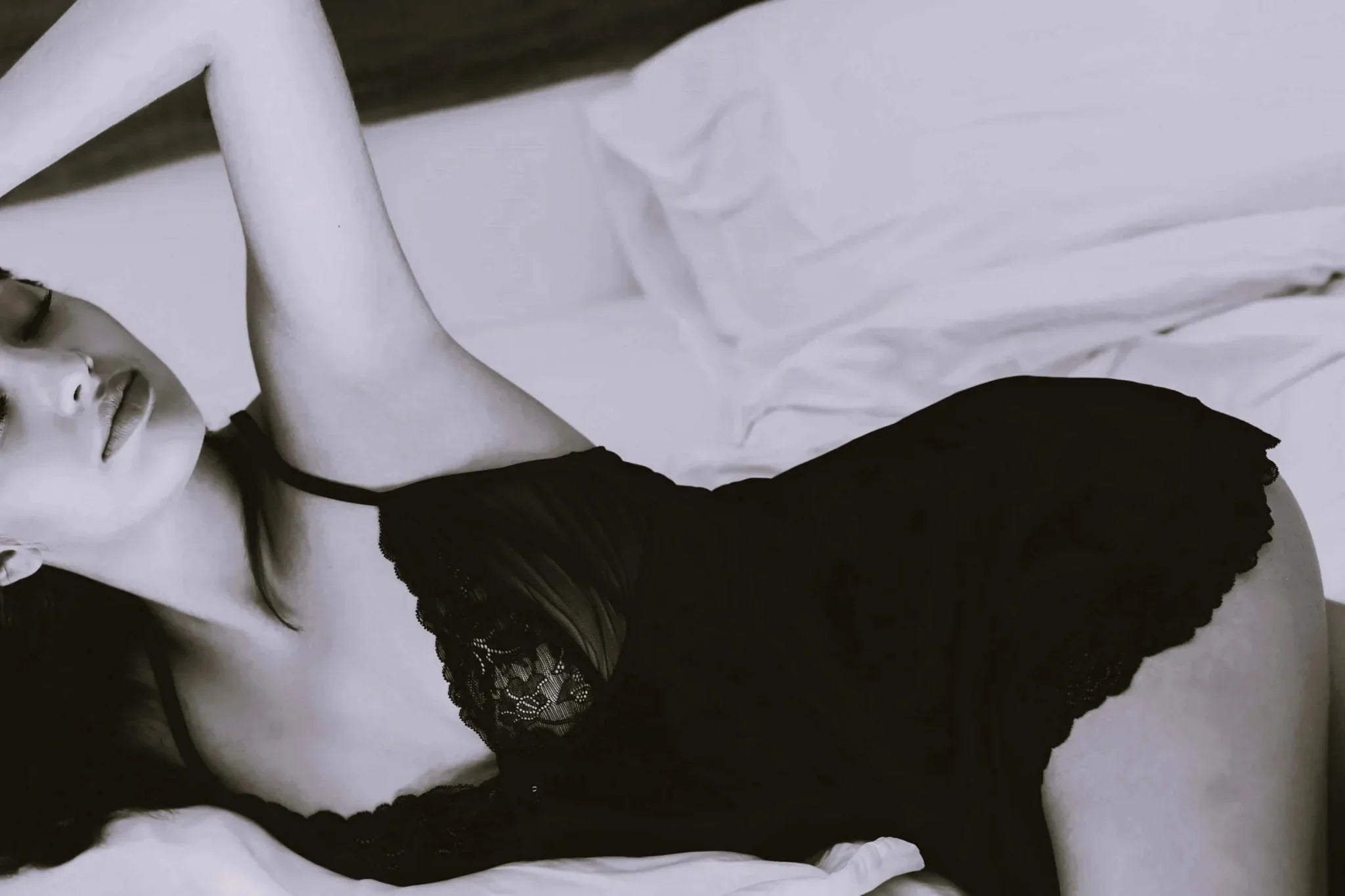 Girl in black lingerie promoting women's strap-on dildos.