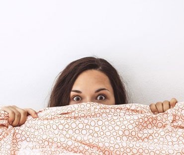 A woman excited to try a dildo for the first time