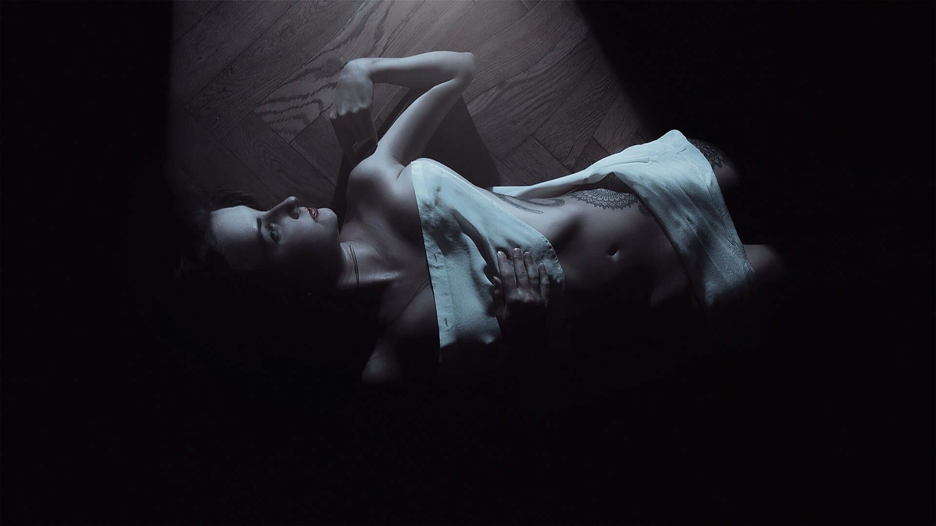 Woman lying on her back dreaming of fantasy dildo sex toys.