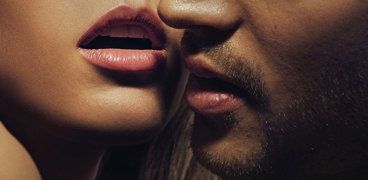 Woman in ecstasy with a man getting ready to kiss her