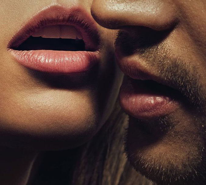 Woman in ecstasy with a man getting ready to kiss her