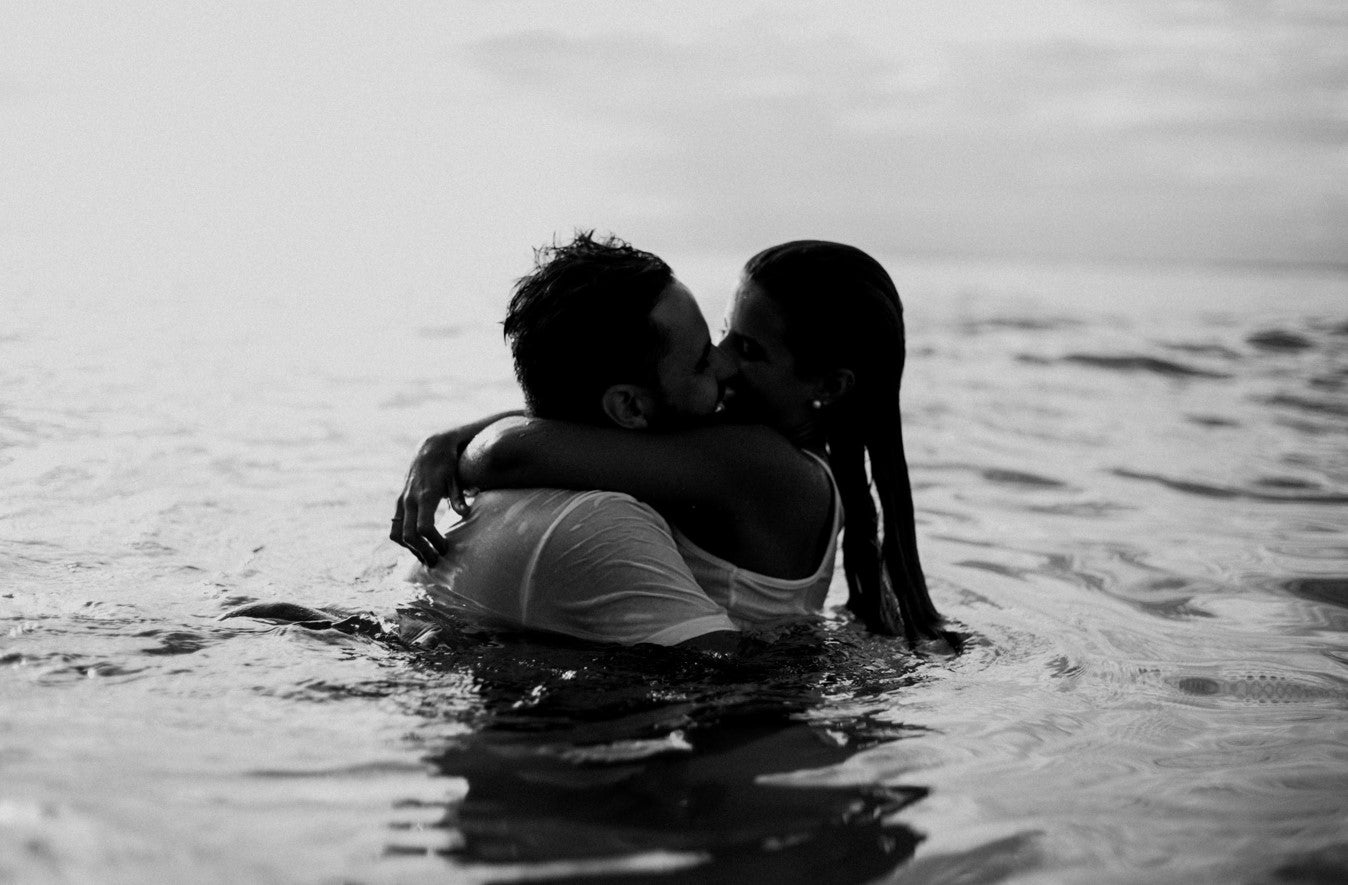 Couple cuddling in the water