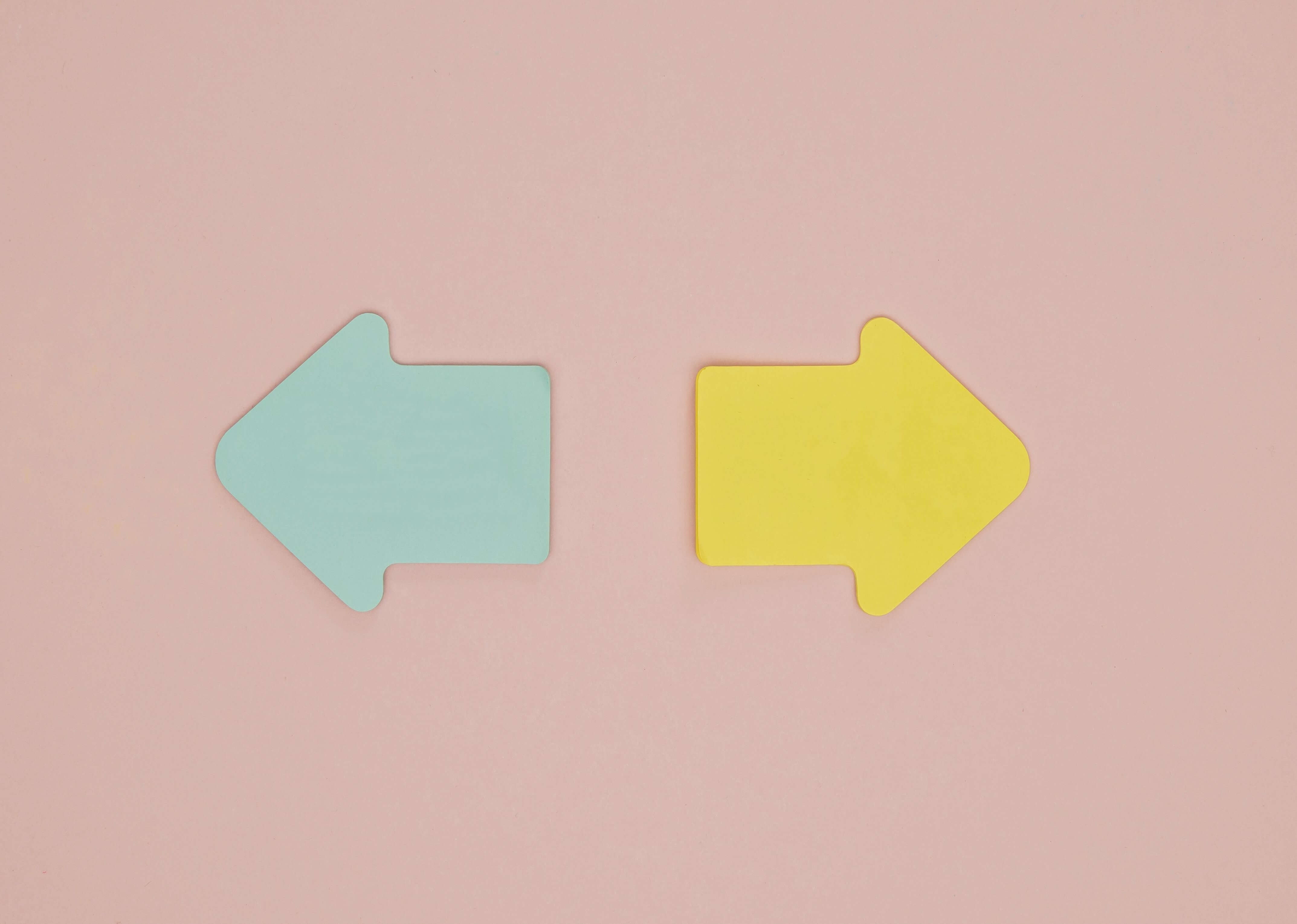 Colorful arrows on a pastel background representing a double-ended design, emphasizing hygiene and cleaning techniques for intimate toys.