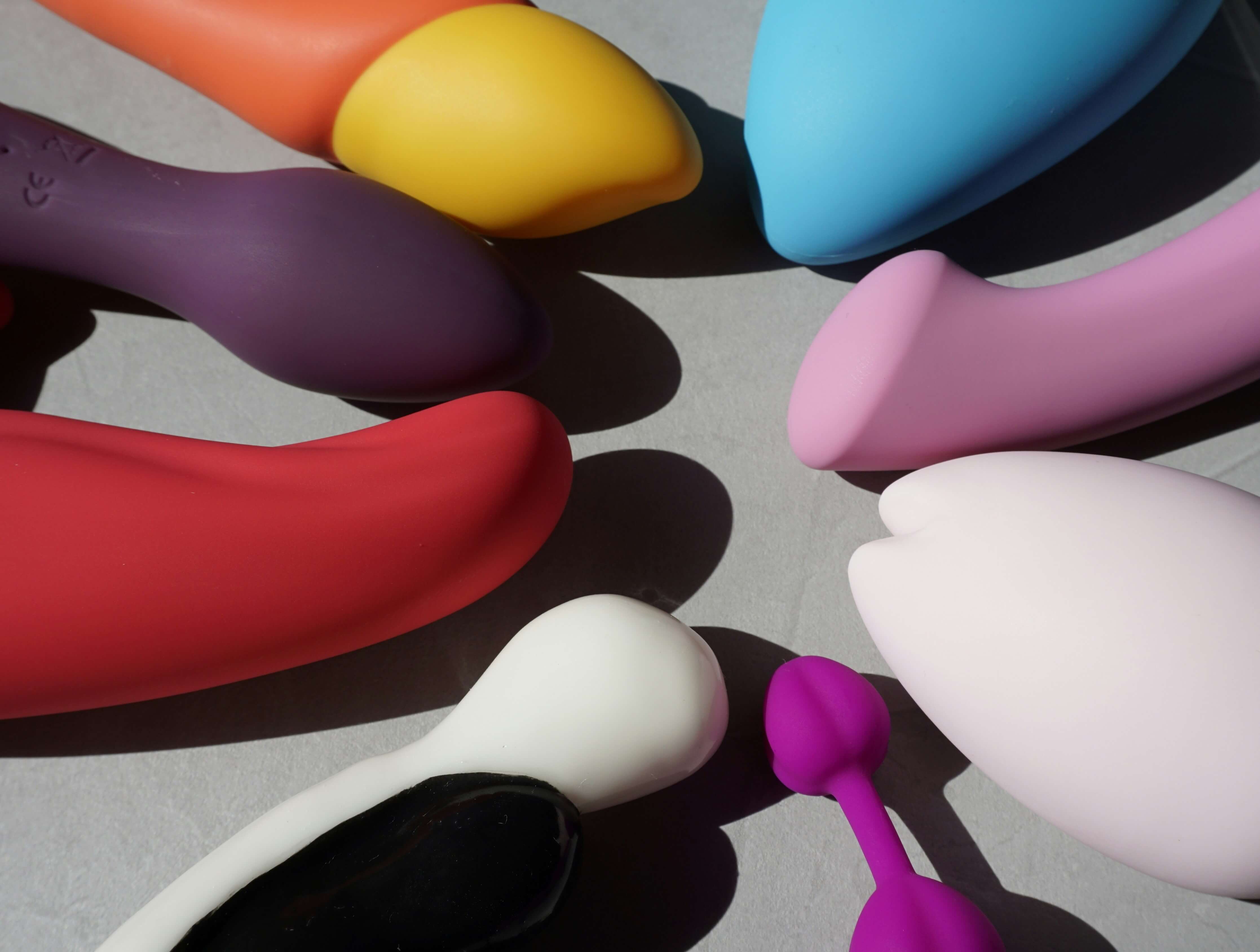 Variety of vibrators placed together, connecting to myths and facts around sexual wellness and safe vibrator use.