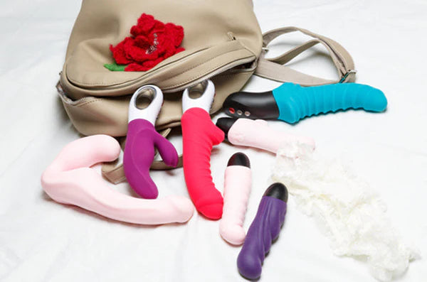 multiple dildos vibrators leaking from handbag